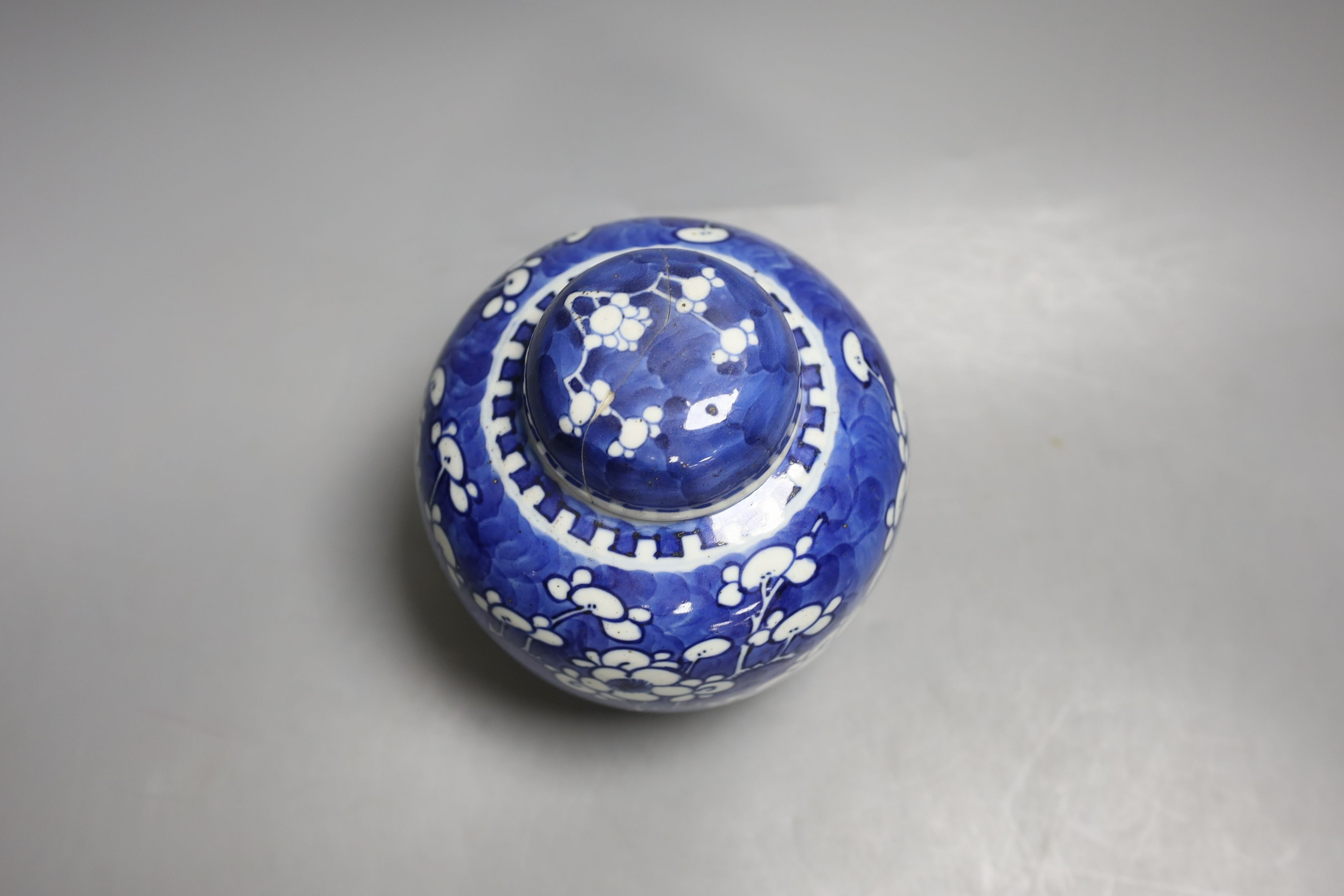 A Chinese blue and white jar and cover, Kangxi mark and of the period, 15cm tall